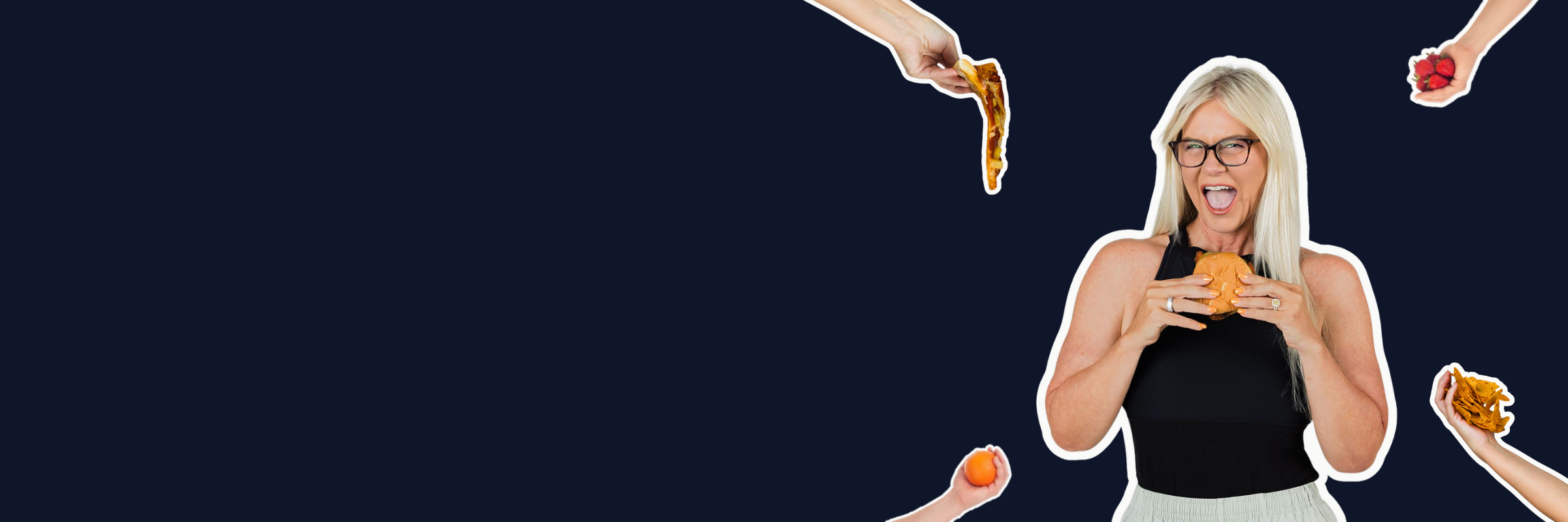 Corinne holding a burger with other food being given to her